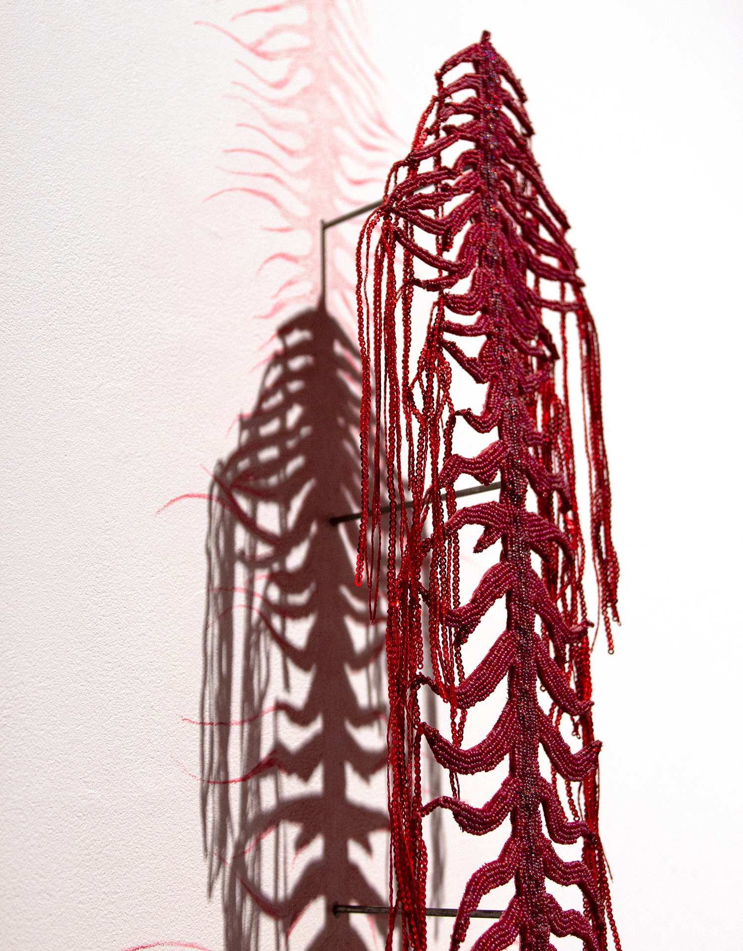 Lux Gow Habrich, Blood Song (Fossil), 2025. Seed beads, sequins, earth magnets, steel rods,
watercolour colouring pencils, cotton, thread. Photo by the artist. https://www.luxgowhabrich.com